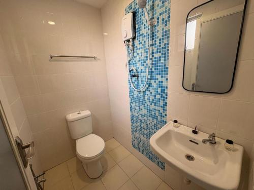 Koupelna v ubytování Aman Inn Hotel