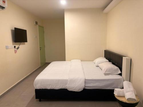 Postel nebo postele na pokoji v ubytování Aman Inn Hotel