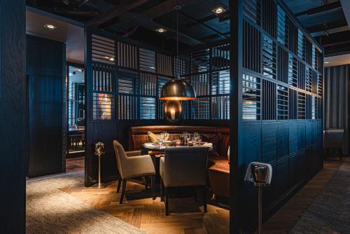 a dining room with a table and chairs at Dakota Newcastle in Newcastle upon Tyne