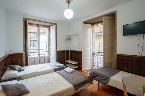 Posteľ alebo postele v izbe v ubytovaní Hostal San Pelayo