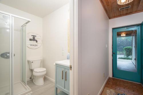 a bathroom with a toilet and a walk in shower at Ocean Grove L1 Lucky Enough condo in Salter Path