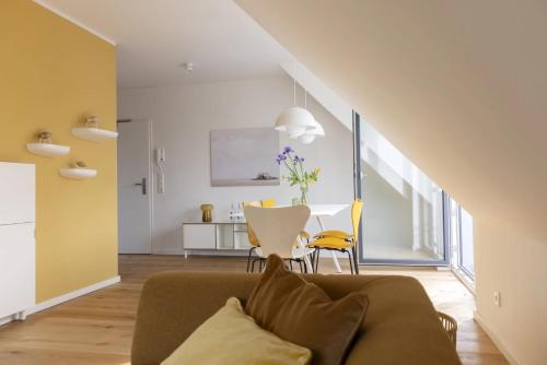 a living room with a couch and a table at Strand in Sankt Peter-Ording