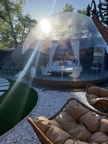 a glass dome living room with a couch and a table at Cazorla Estelar in Cazorla