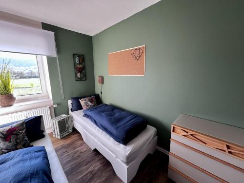 Postel nebo postele na pokoji v ubytování Ferienwohnung Weidentriesch
