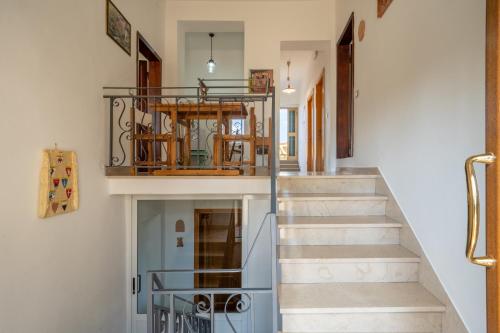 a staircase leading to the second floor of a house at Bed and Breakfast Mea Familia in Vinci