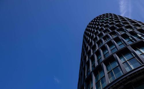 a tall building with a blue sky in the background at art'otel London Hoxton in London