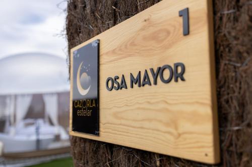 a sign on a tree that says osa navvier at Cazorla Estelar in Cazorla