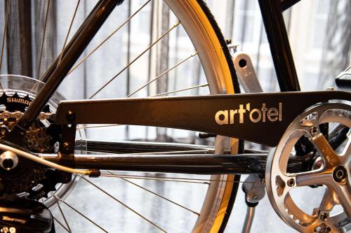 a bike wheel with the word artifact on it at art'otel London Hoxton in London