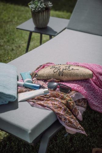 a picnic table with a blanket and utensils on it at Althoff Seehotel Überfahrt in Rottach-Egern