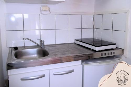 Η κουζίνα ή μικρή κουζίνα στο Les appartements Cook