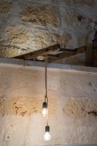 a chandelier hanging from a ceiling in a room at La casa a corte con terrazzo - Artemisia Homes in Spongano