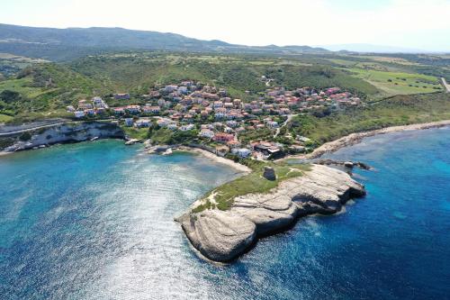 an aerial view of a small island in the ocean at Sardinianworld - Josto Panoramic House in S'archittu Cuglieri