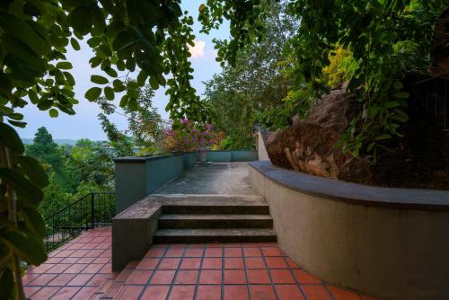 a set of stairs leading up to a house at Villa Rumassala Luxury Chalets Unawatuna in Unawatuna