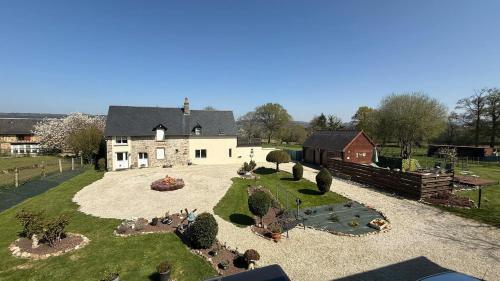 an aerial view of a house with a garden at Maison la touchardiere in Barenton