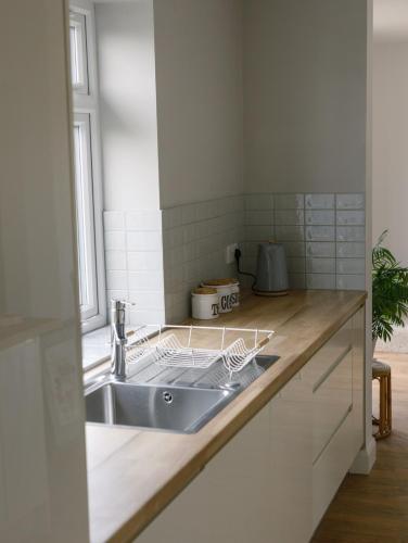 a kitchen with a sink and a counter at No 26 The perfect Brighton Getaway in Brighton & Hove