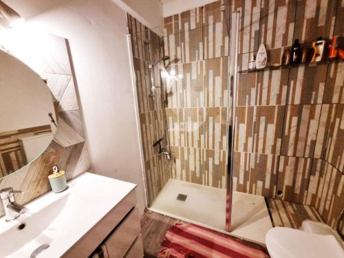 a bathroom with a shower and a sink at Sun & Fun in Armacao de Pera in Armação de Pêra