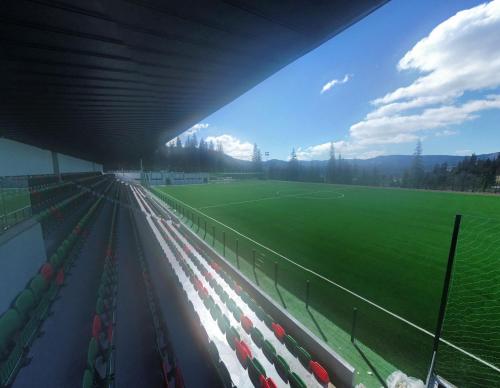 a view of a soccer field from inside a stadium at Vila Sport Borsec in Borsec