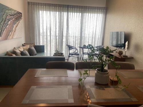 a living room with a table and a couch at Colombo, Trizen Luxury Apartments, Sri Lanka in Colombo