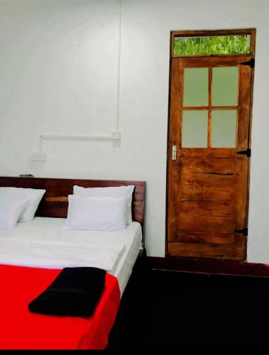 Postel nebo postele na pokoji v ubytování Minthu Homestay