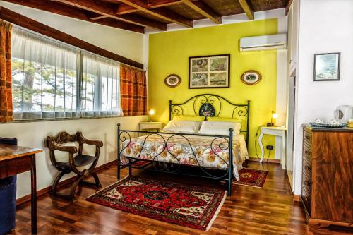 Ένα ή περισσότερα κρεβάτια σε δωμάτιο στο B&B Villa Bency