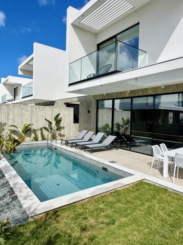 an image of a house with a swimming pool at Elysian blue villa 1 in Paphos