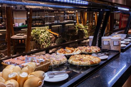 a buffet line with many different types of food at Nikkey Palace Hotel in Sao Paulo