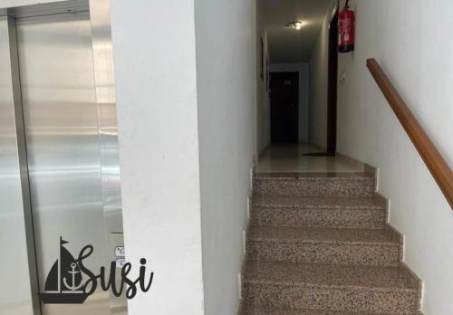 a hallway with a stairway with a glass case at Susi in Santa Cruz de la Palma