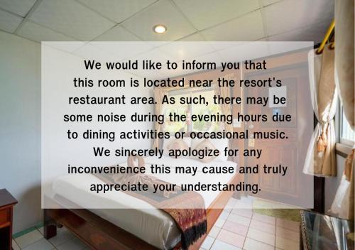 a sign on a wall in a room at Tongta Phaview Resort in Ko Samed