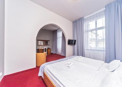 Postel nebo postele na pokoji v ubytování Hotel Marczewski