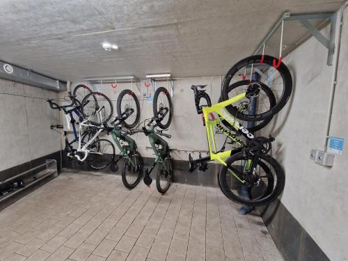a group of bikes parked in a garage at Bergzeit - Hotel & Appartements in Oberjoch