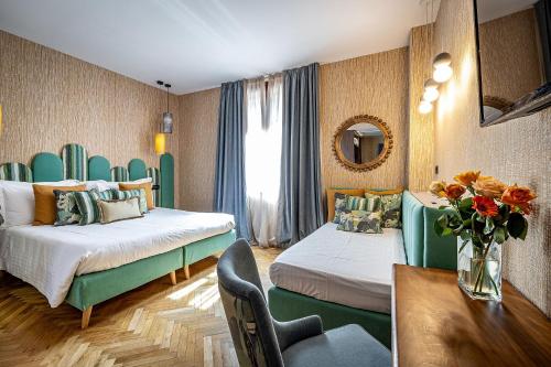 Postel nebo postele na pokoji v ubytování Hotel Duomo Firenze