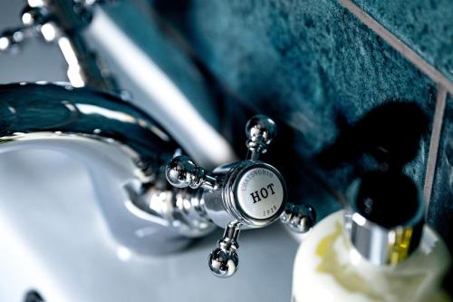 a close up of a bathroom sink with a faucet at 82A Dalston Lane Terrace in London