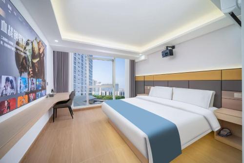 Postel nebo postele na pokoji v ubytování Shengmeiya Apartment Hotel-Line8 Pazhou STN entrance D-Walking distance to Canton Fair