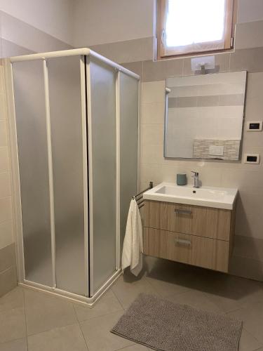 a bathroom with a shower and a sink at Amalia-Levico Terme Apartment in Levico Terme