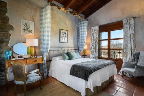 Postel nebo postele na pokoji v ubytování Hotel Barosse