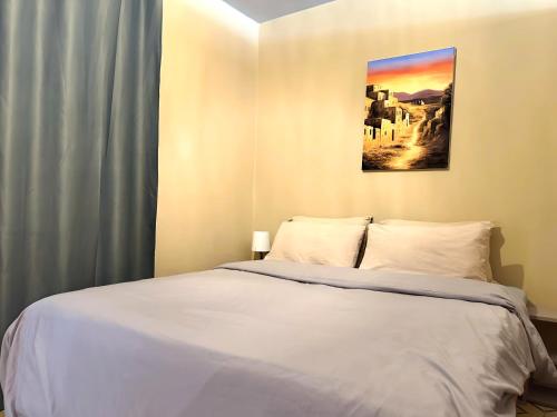Postel nebo postele na pokoji v ubytování Cosy appartement au super centre ville avec vue partielle sur le parc