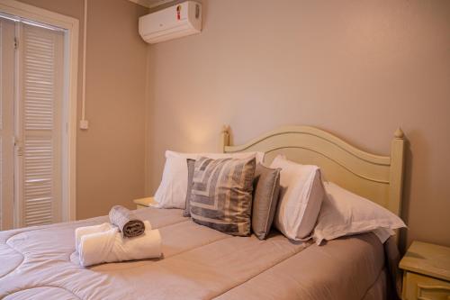 Katil atau katil-katil dalam bilik di Hospedagem Vila Suiça Centro