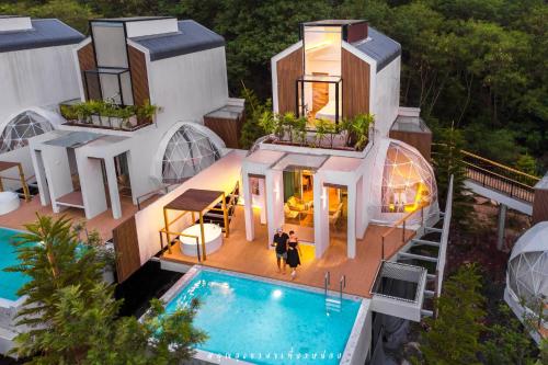 an aerial view of a house with a swimming pool at The X10 Nordic Tent and Glamping Pool Villa Khaoyai เขาใหญ่ - SHA Certified in Ban Thung Sawang