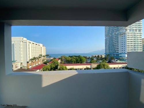 a view of a city from the balcony of a building at Sealife Hostel in Quy Nhon