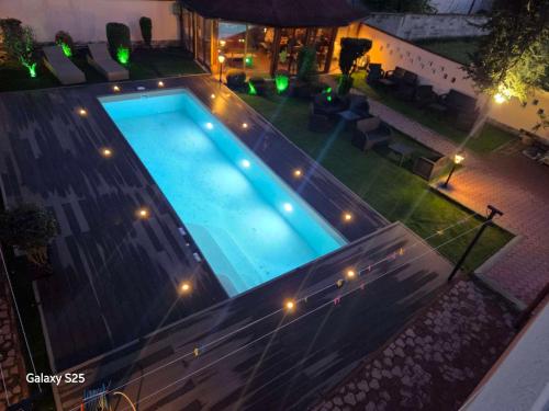 an overhead view of a swimming pool at night at Family Hotel Kedara in Burgas City