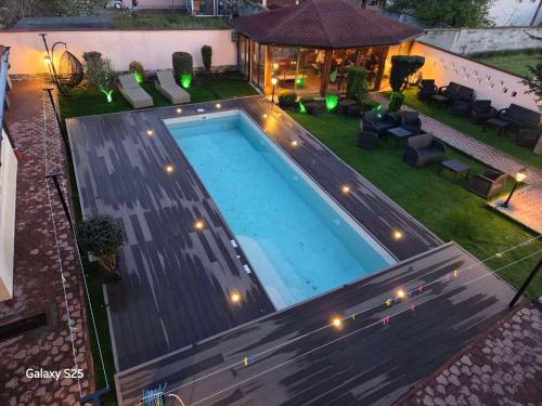 an overhead view of a swimming pool in a backyard at Family Hotel Kedara in Burgas City