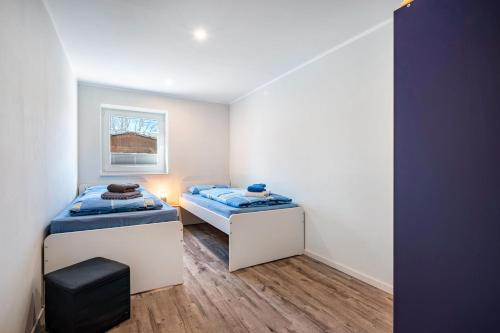 Postel nebo postele na pokoji v ubytování Ferienwohnung Leuchtturm
