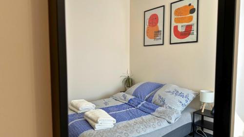 Ένα ή περισσότερα κρεβάτια σε δωμάτιο στο Noclegi Słodki Sen 2