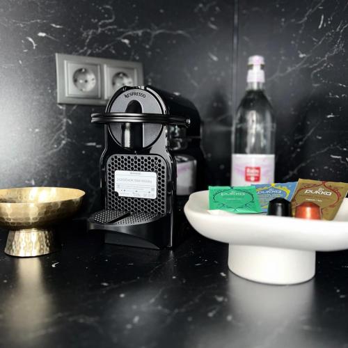 a coffee maker sitting on a counter next to a sink at Apartment in zentraler Lage in Bad Neustadt an der Saale