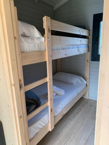 a couple of bunk beds in a room at Càmping Organyà Park in Organyà
