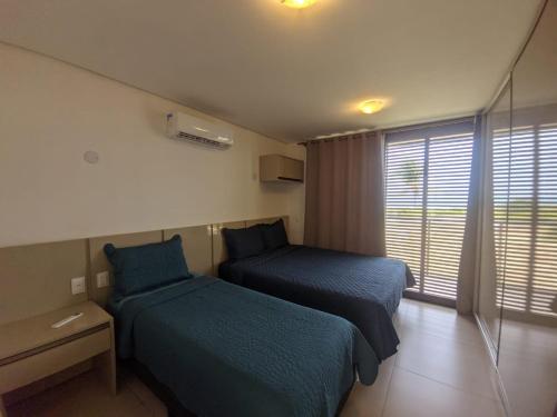 Ένα ή περισσότερα κρεβάτια σε δωμάτιο στο Casa em Condomínio Flecheiras