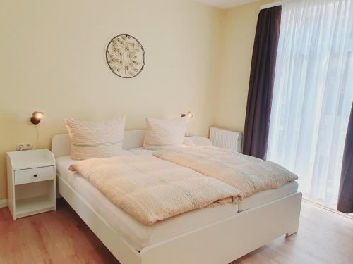 En eller flere senge i et værelse på Harzhaus am Brunnen