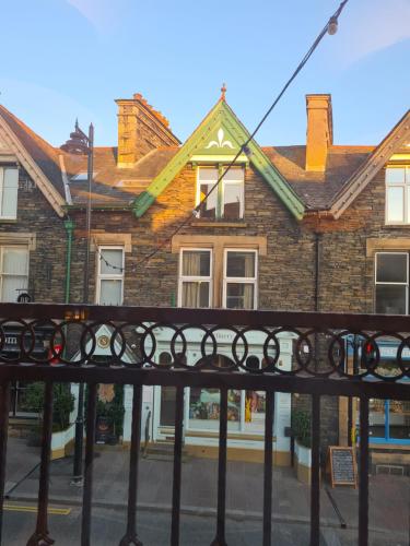 a house with a fence in front of it at Heart of Windermere in Windermere