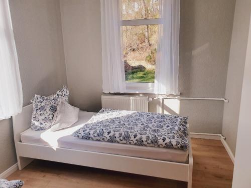 En eller flere senge i et værelse på Harzhaus am Brunnen