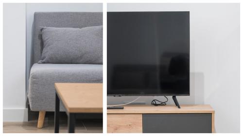 Μια τηλεόραση ή/και κέντρο ψυχαγωγίας στο GM Toledo Apartamentos by Toledo AP
